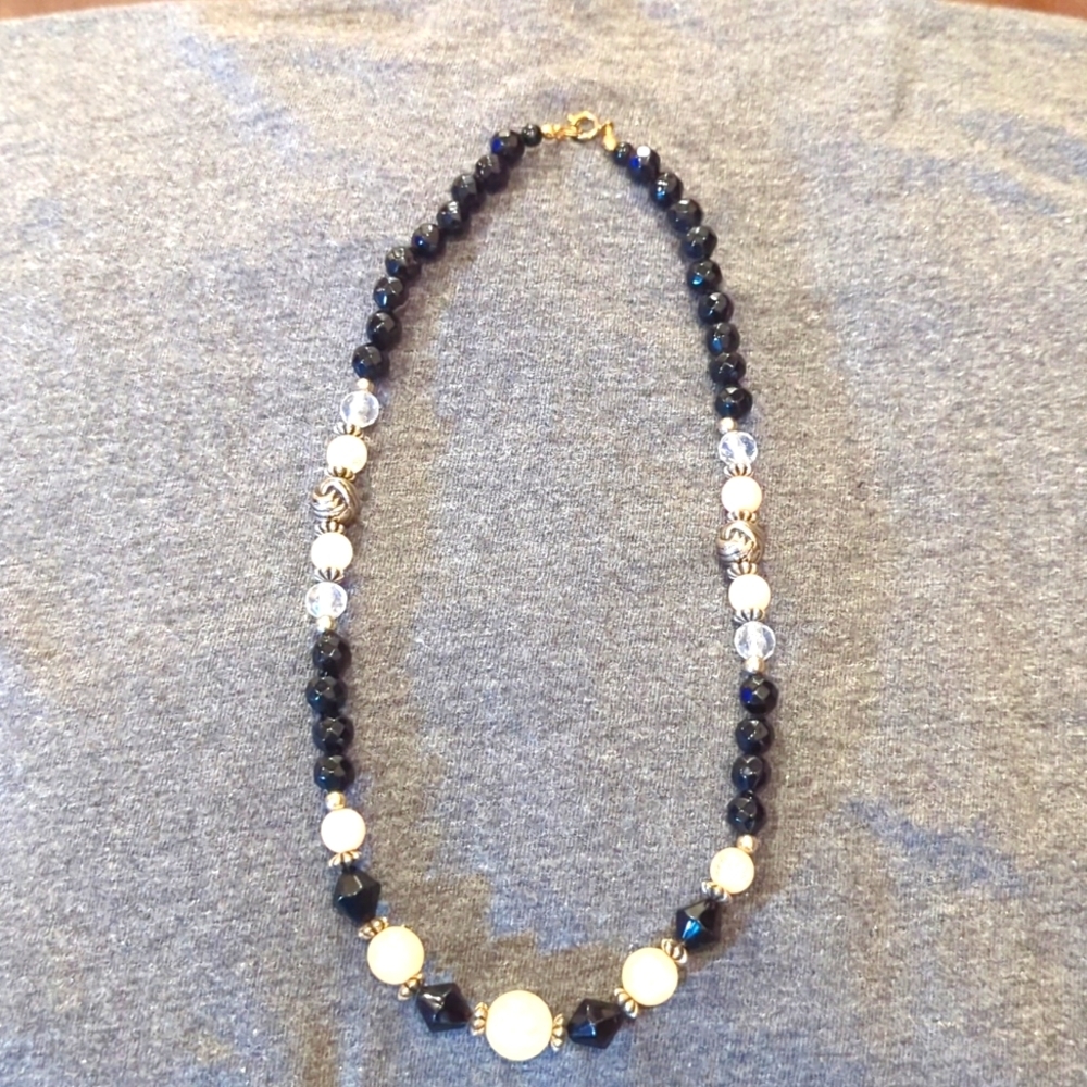 Women's black, pink and clear ball necklace.